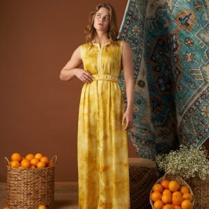 Yellow tie-dye sleeveless Moroccan kaftan with an embroidered belt cinching the waist